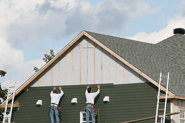 Professional Emergency Siding Repair technician working in Rock Creek, OH